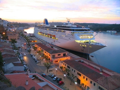 View of the beautiful cruise ship berthed in front of the park Rochina and near the port authority building of Mahon 